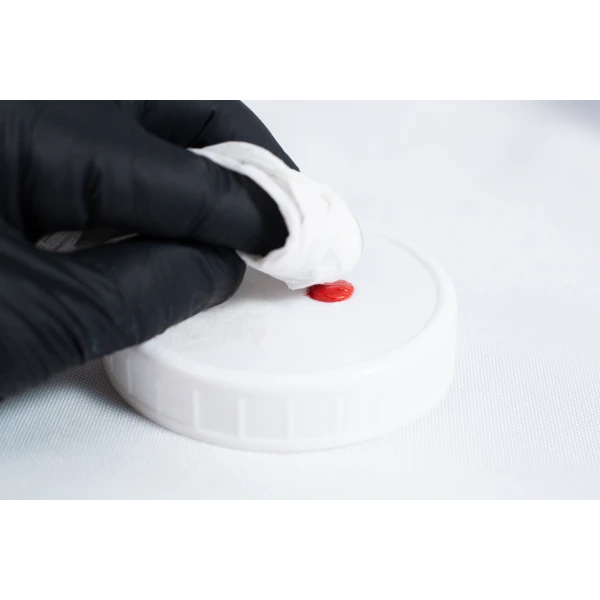 This picture shows high temperature RTV Silicon being applied on a Liquid culture Jar.