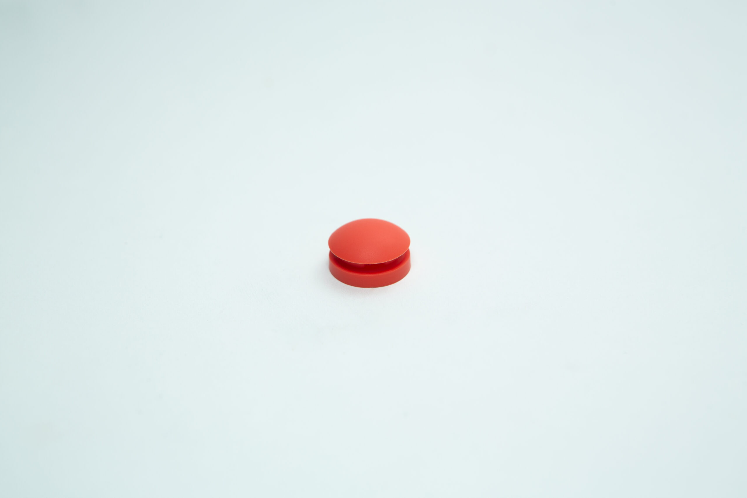 An All American orange rubber overpressure plug for sterilizer (Part 1010) is centered on a plain white background.