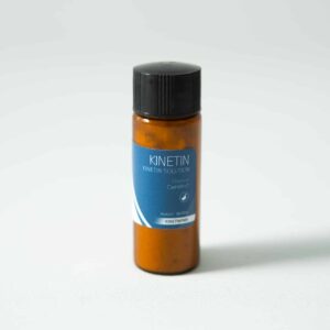 A brown bottle with a black cap labeled Plant Cell Kinetin Powder, ideal for plant cell research, on a plain white background.