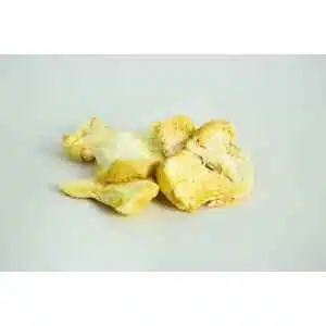 Several pieces of fresh lion’s mane mushroom on a plain white background.
