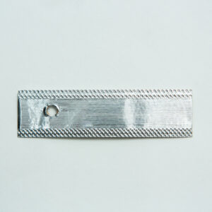 A rectangular silver metal piece with a hole on one end, displayed on a plain white background.