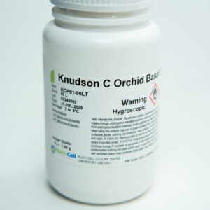 White plastic container labeled Knudson C Orchid Base with warning and product information text.