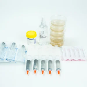 The Spore Print to Spore Syringe Transfer Kit, featuring syringes, a spore syringe, petri dishes, a spray bottle, and a yellow-lidded container, is displayed on a white surface.